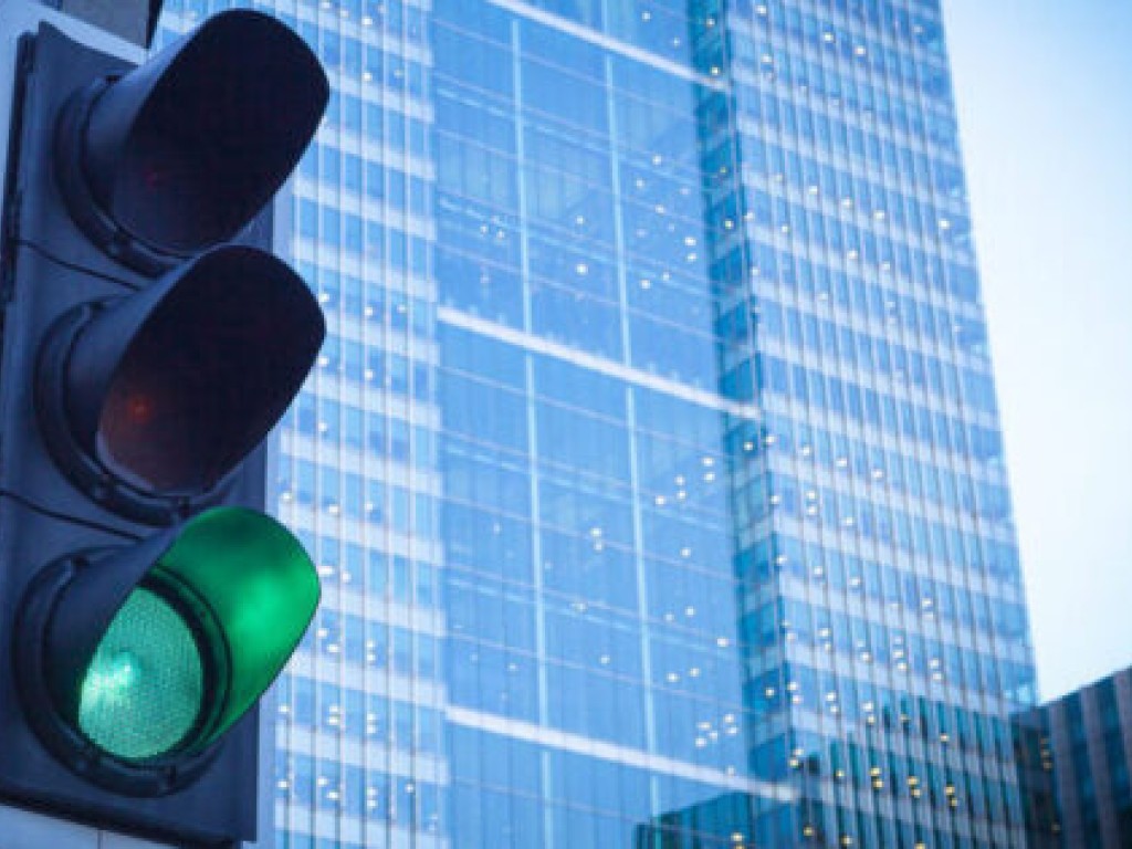 Implementing Stochastic Models for Intersections with Regulated Traffic
